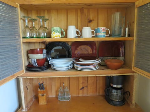 Fridge, stovetop, coffee/tea maker, cookware/dishes/utensils