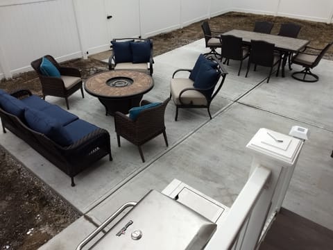 Large patio in fenced in yard with plenty of room to gather!