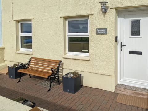 Sitting-out area with garden furniture | Seascape Cottage, Allonby, near Maryport