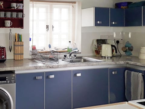 Well appointed kitchen with laundry facilities | Woodlands Cottage, Hook, near Haverfordwest