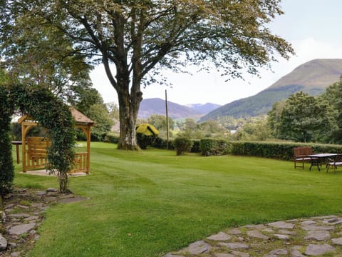 Peaceful gardens with sitting out areas | Jose’s at the Grange - Grange Country House Holiday Cottages, Loweswater, near Cockermouth