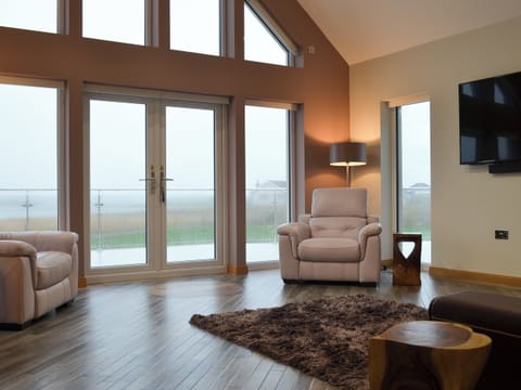 Living room with 65 inch Sky Q Smart TV | Skipper’s Retreat, Clachan Sands, Isle of North Uist