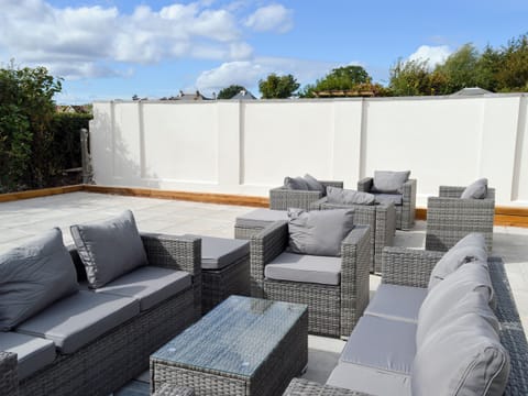 Large enclosed garden with decking, patio and garden furniture | Estuary View, Exmouth