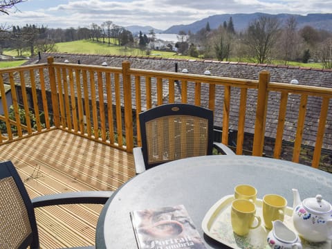 Decked area with table and chairs | Woodside Cottage, Ecclerigg, near Ambleside