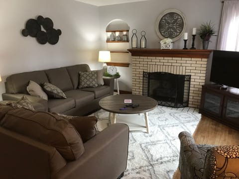 Living room with comfortable seating for six guests.