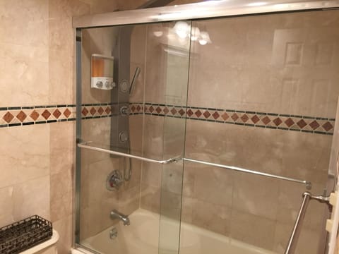 Combined shower/tub, hair dryer, towels, soap