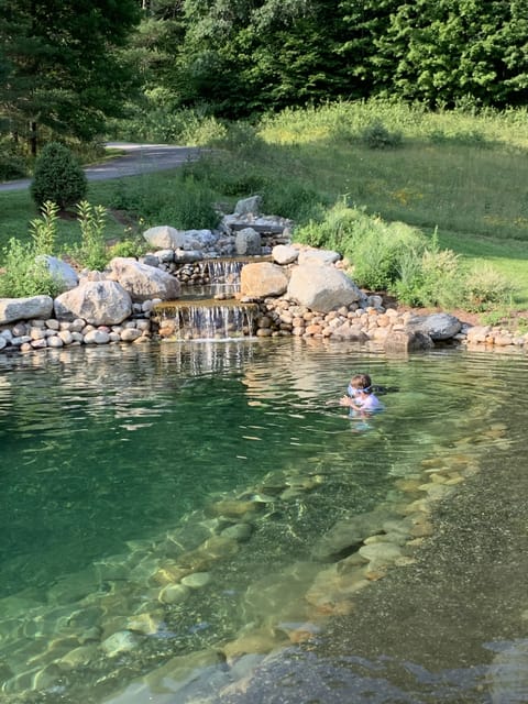 Yes your kids can swim in it - perfect natural spring water.  Designed for swim.