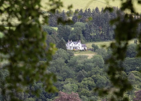 Farmhouse set in large mature gardens and surrounded by farmland and woods