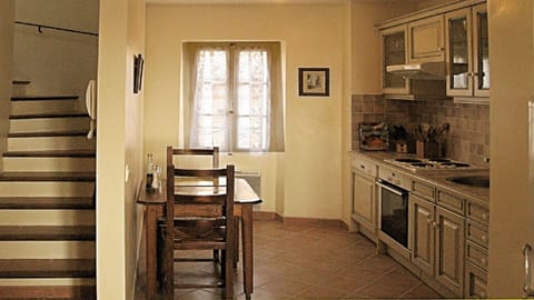 Kitchen, Breakfast Table, Window over Old Village and Stairs to Bedrooms & Bath