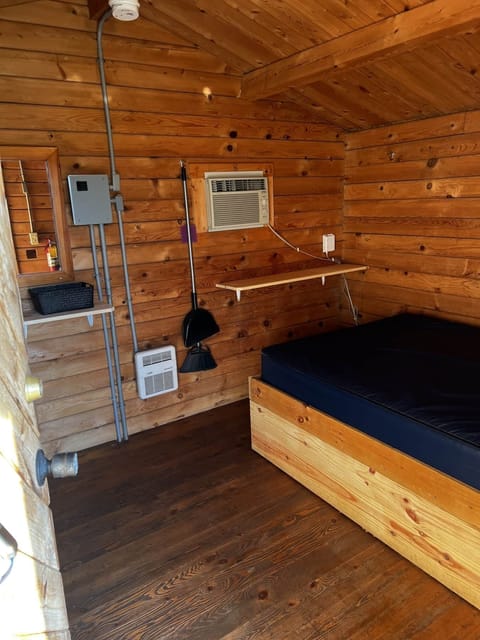 A simple platformed full size bed and twin bunk bed.