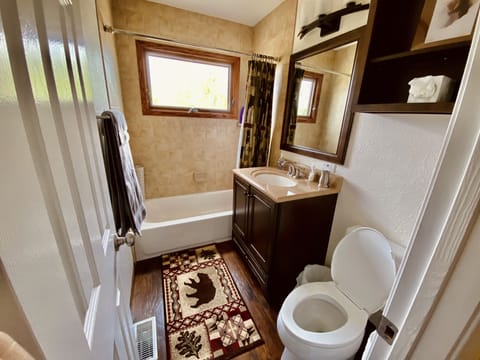 The upstairs bathroom features a tub.