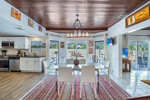 Dining room opens to the pool deck.
High table with 2 stools + an office/desk