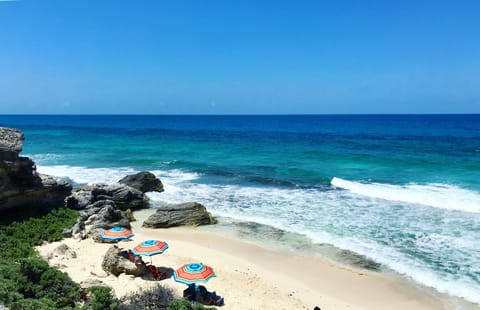 On the beach, sun loungers, beach towels