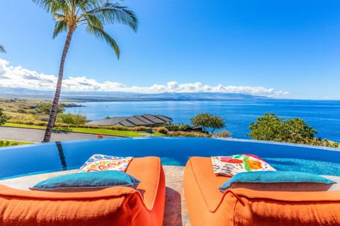 An infinity pool, sun loungers