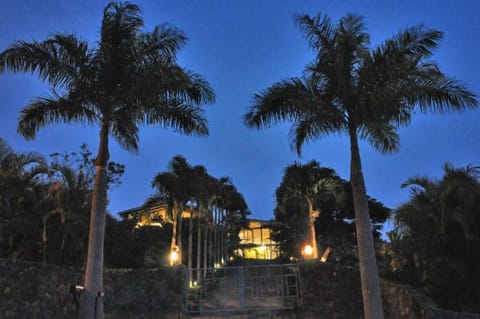 Coming up the gated driveway, at night...the guest house is on the left
