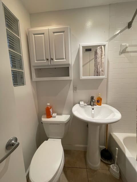 Combined shower/tub, hair dryer, towels, soap