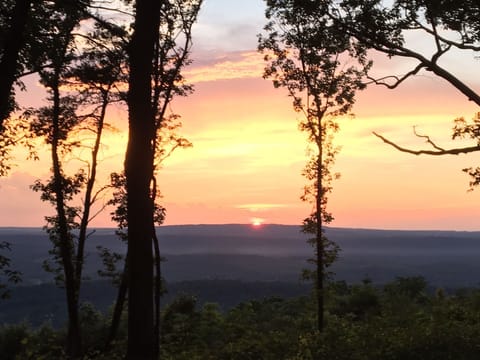 Unbelievable sunsets! Here's your front porch view from at Moonflower Cottage.