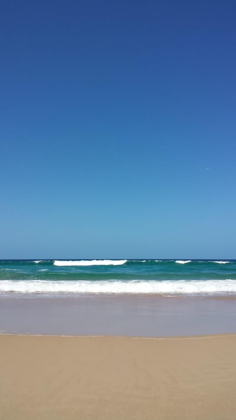 On the beach, sun loungers, beach towels