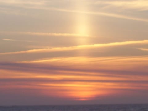 SUN PILLER SUNSET FROM THE HOUSE AND DECK WITH THE BEACH ABOUT 50 FEET WEST
