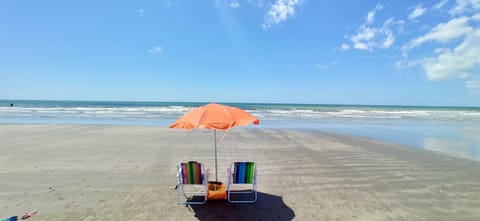 On the beach, sun loungers