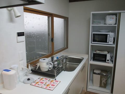 Fridge, microwave, highchair, cookware/dishes/utensils