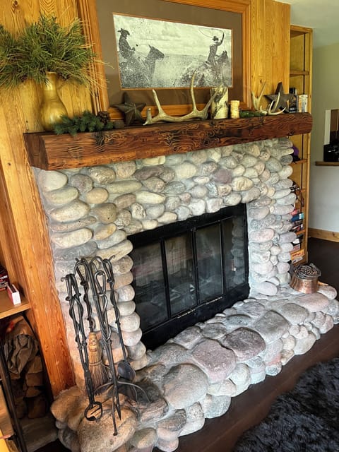 Wood-burning natural stone fireplace