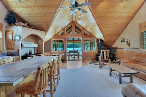 Enter to the vaulted and open concept main living area & greeted by lake views.