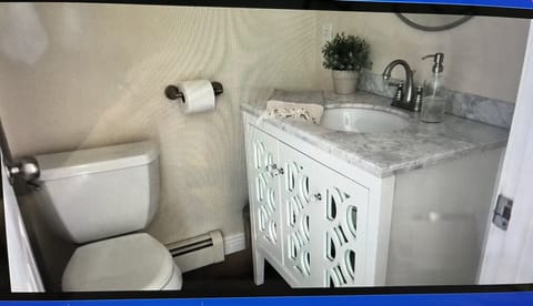 Combined shower/tub, hair dryer, towels, toilet paper