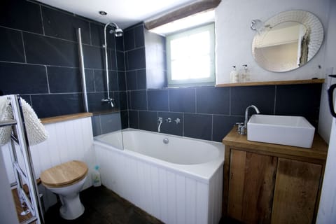 Family bathroom with overhead shower on 1st floor