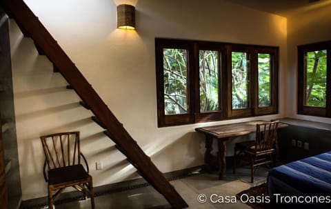 The Treehouse second bedroom, with double bed, and treetop views on three sides