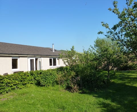 French doors opening onto the enclosed shared patio area.