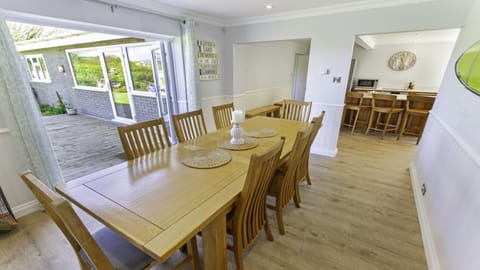 Large dining table open plan kitchen
