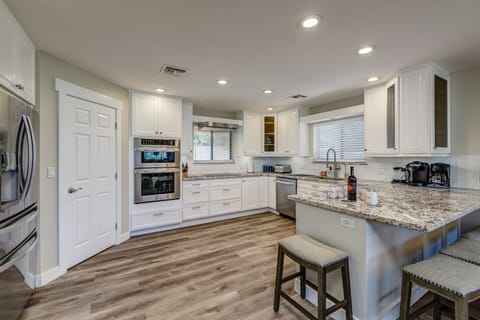 Completely Renovated Kitchen with New Stainless Steel Appliances, Granite Counters and Kitchen Bar Seating