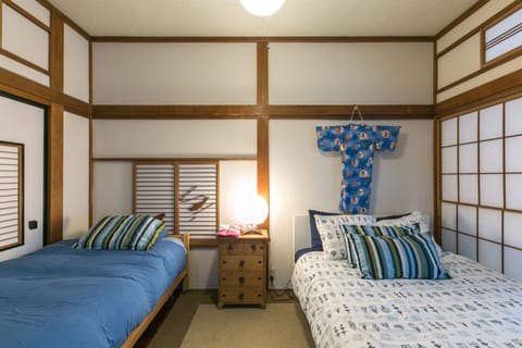 Bedroom 1- double bed & single bed, Japanese decor |Samurai House Tokyo Family Stays |Spacious