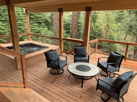 Lower deck with Bullfrog hot tub and comfy lounge area- (not a fire pit)