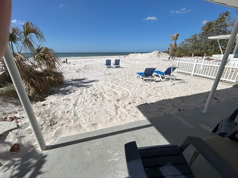 On the beach, sun loungers, beach towels