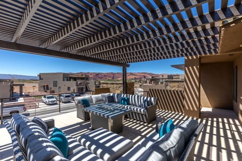 Upstairs Patio West View - The views from the upstairs patio are stunning. You can enjoy majestic sandstone cliffs of Snow Canyon State Park directly from our home.