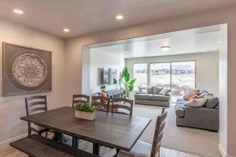 Downstairs Living Area - The living room is designed as an open floor plan and is a great gathering place for meals, games, or watching TV during your stay.