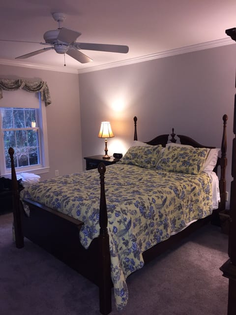 Master bedroom suite on ground floor with queen bed