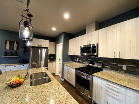 Huge kitchen that opens up to living/dining area. Well stocked for home cooking.