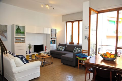 Bright and roomy combined living and dining area leading to the outside balcony