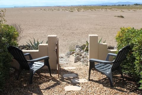 On the beach, sun loungers