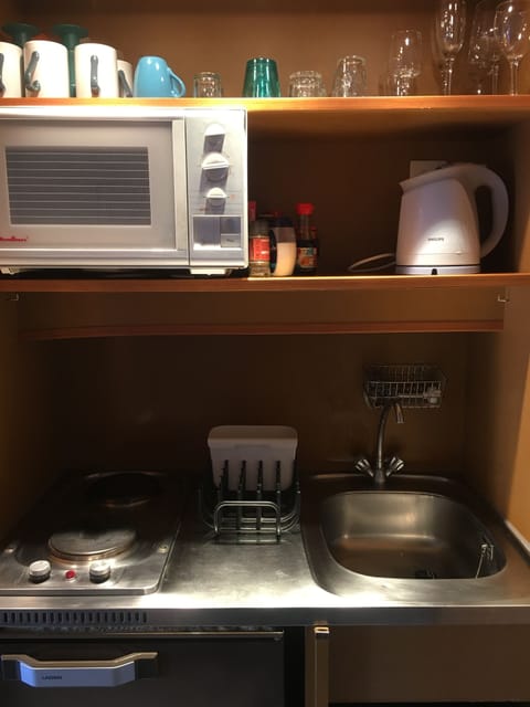 Fridge, microwave, stovetop, coffee/tea maker