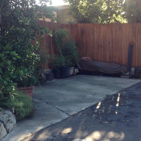 Off street parking for one vehicle with fenced inner garden/patio.