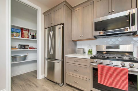 Modern kitchen with pantry. New refrigerator, and dishwasher purchased in 2022. 
