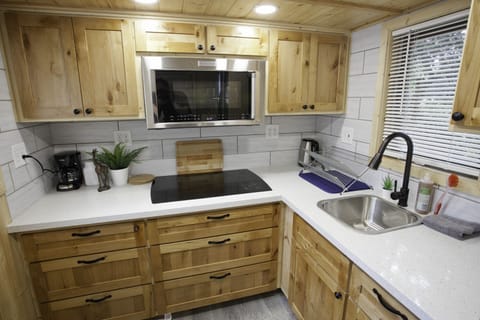 quartz counter tops, convection microwave, coffee maker, hot water pot