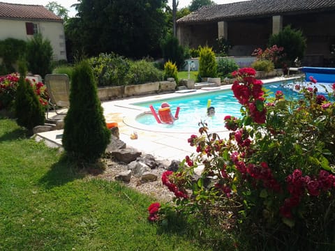 Outdoor pool, a heated pool, sun loungers