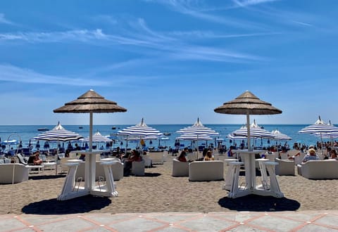 On the beach, sun loungers, beach towels