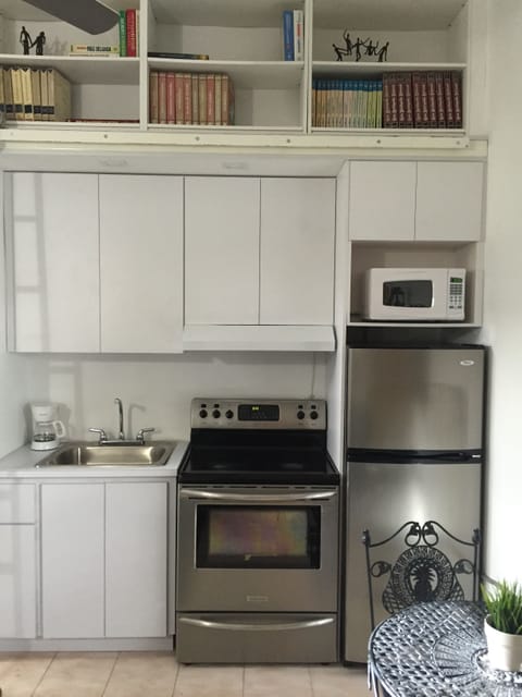 Fridge, microwave, stovetop, coffee/tea maker