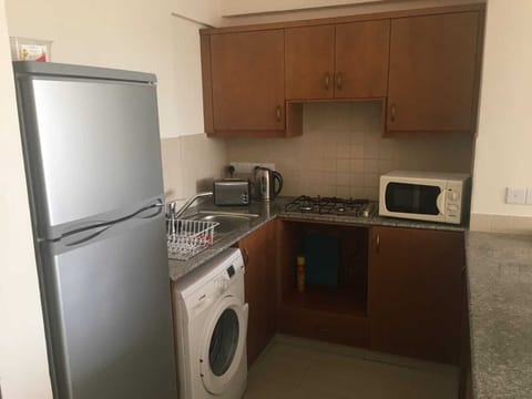 Fridge, stovetop, toaster, cookware/dishes/utensils